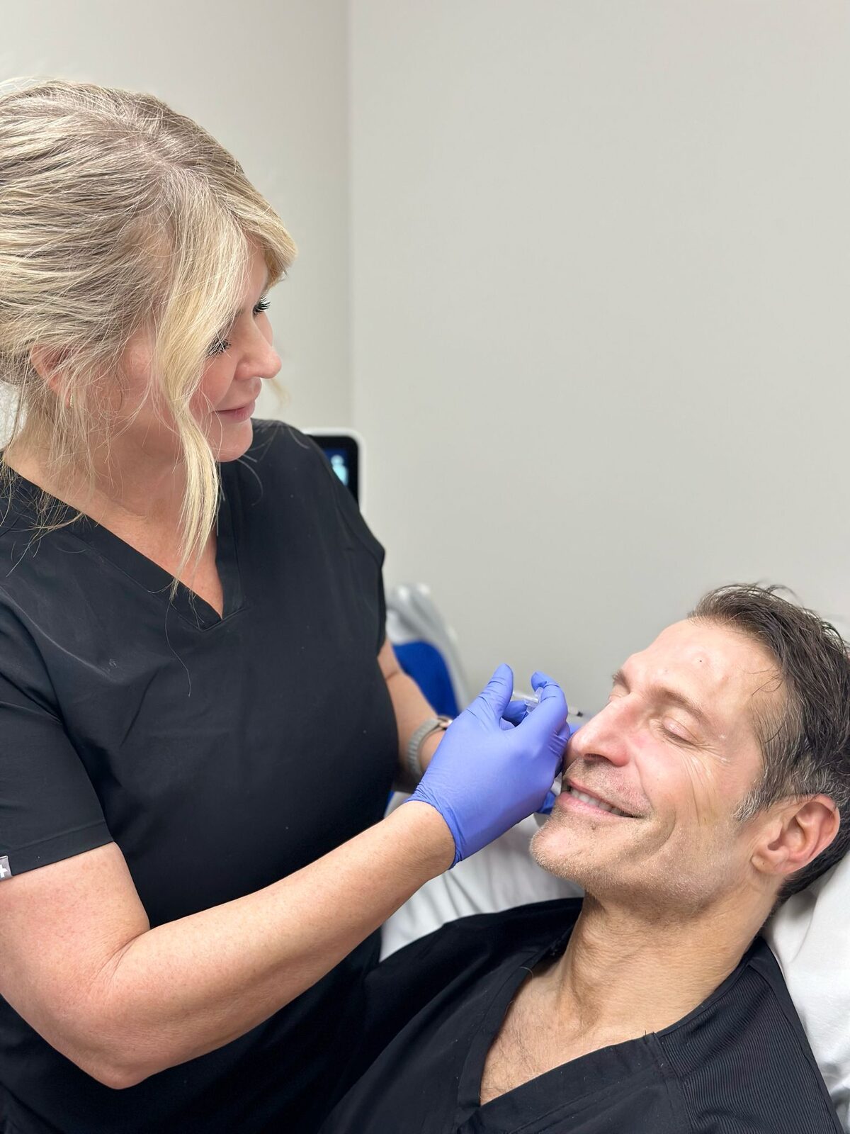 A Back to 30 provider administering an injectable treatment